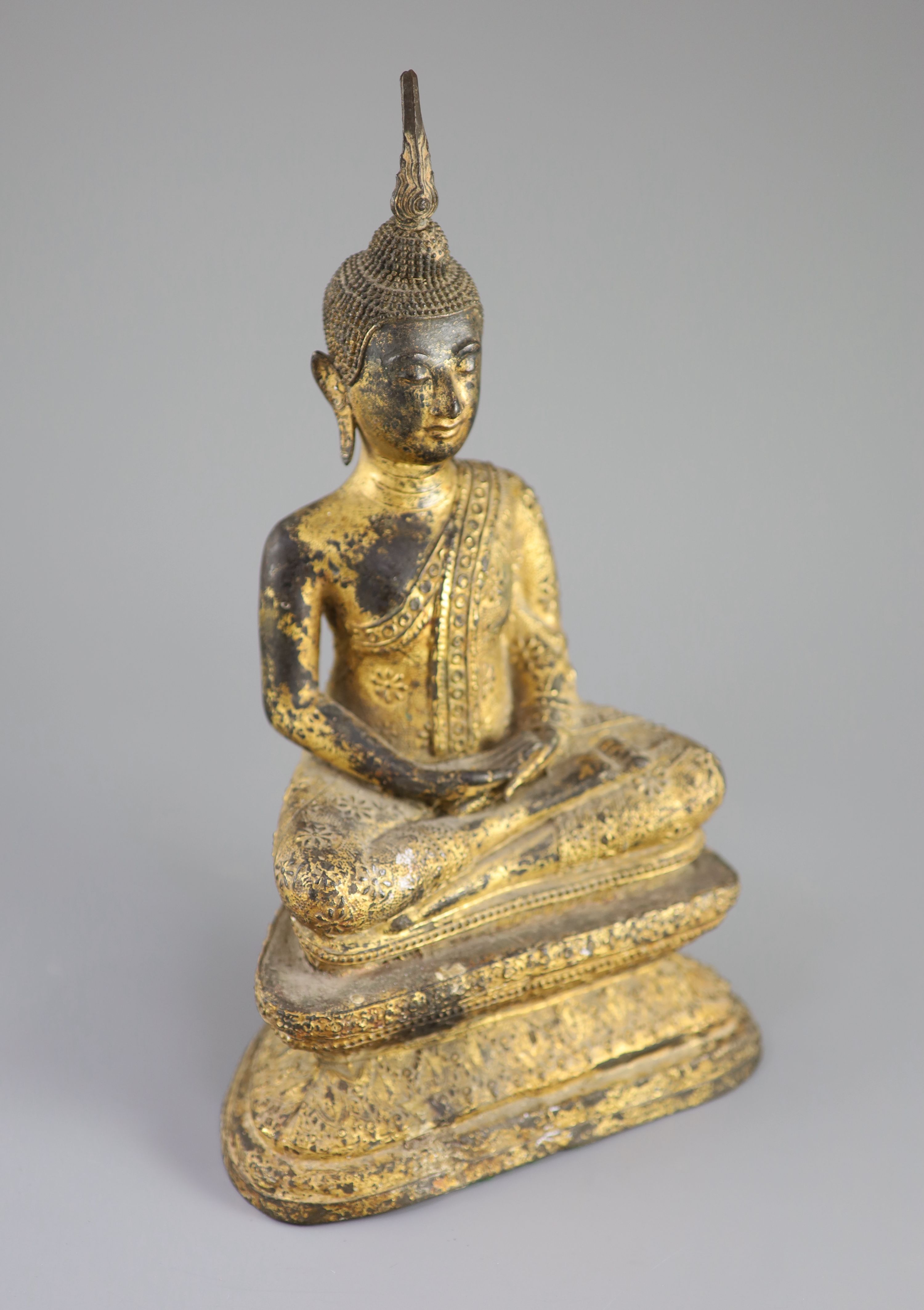 A Thai gilt bronze seated figure of Buddha, 18th/19th century, 33 cm high
